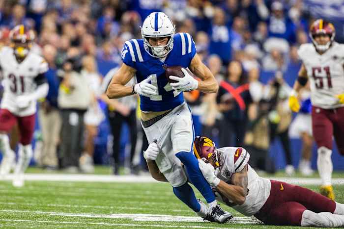 Oct 30, 2022; Indianapolis, Indiana, USA; Indianapolis Colts wide receiver Alec Pierce (14) catches the ball while Washington Commanders cornerback Benjamin St-Juste (25) defends in the second half at Lucas Oil Stadium.